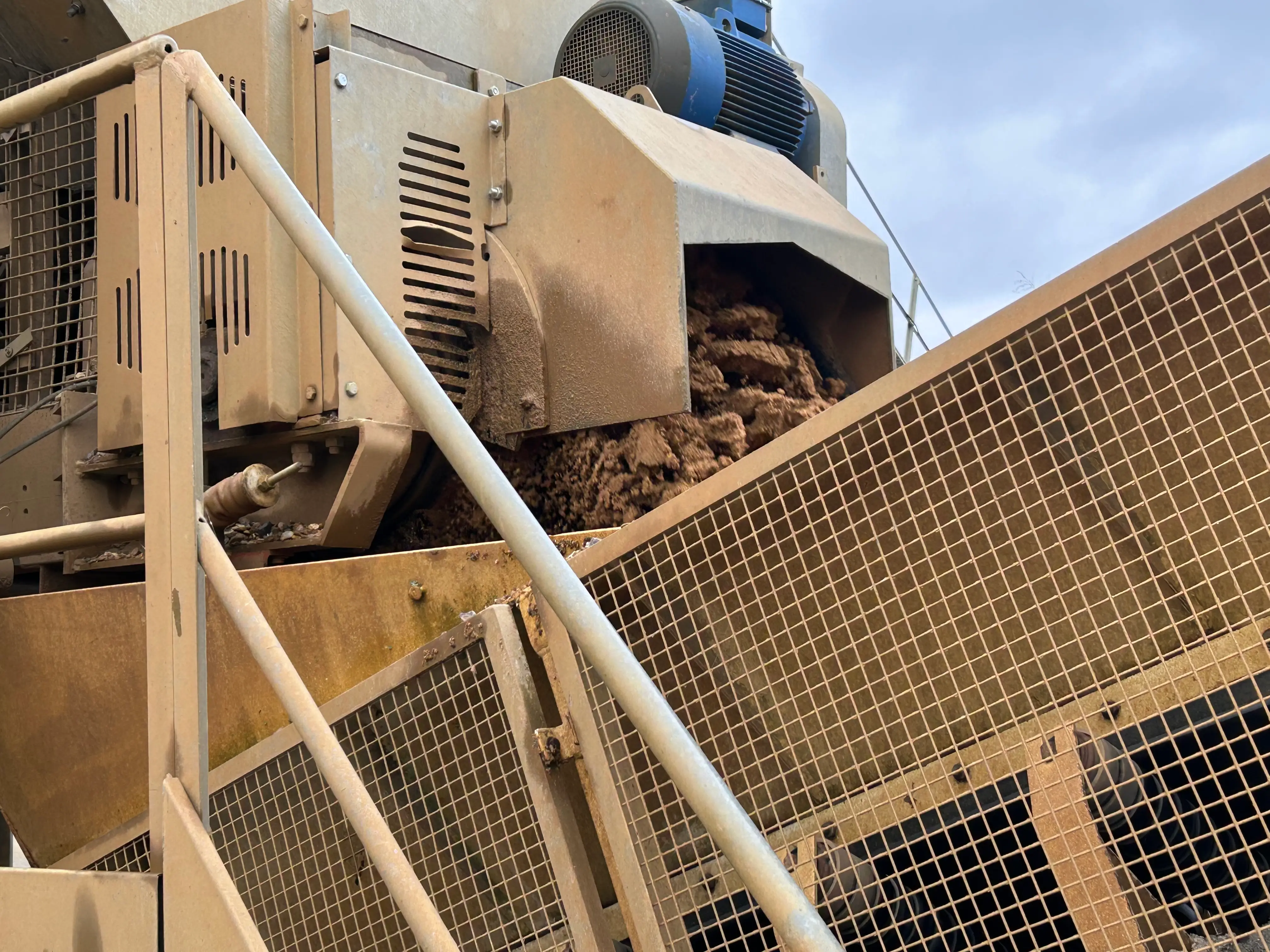 Concrete batching conveyor system supplying residential foundation installations