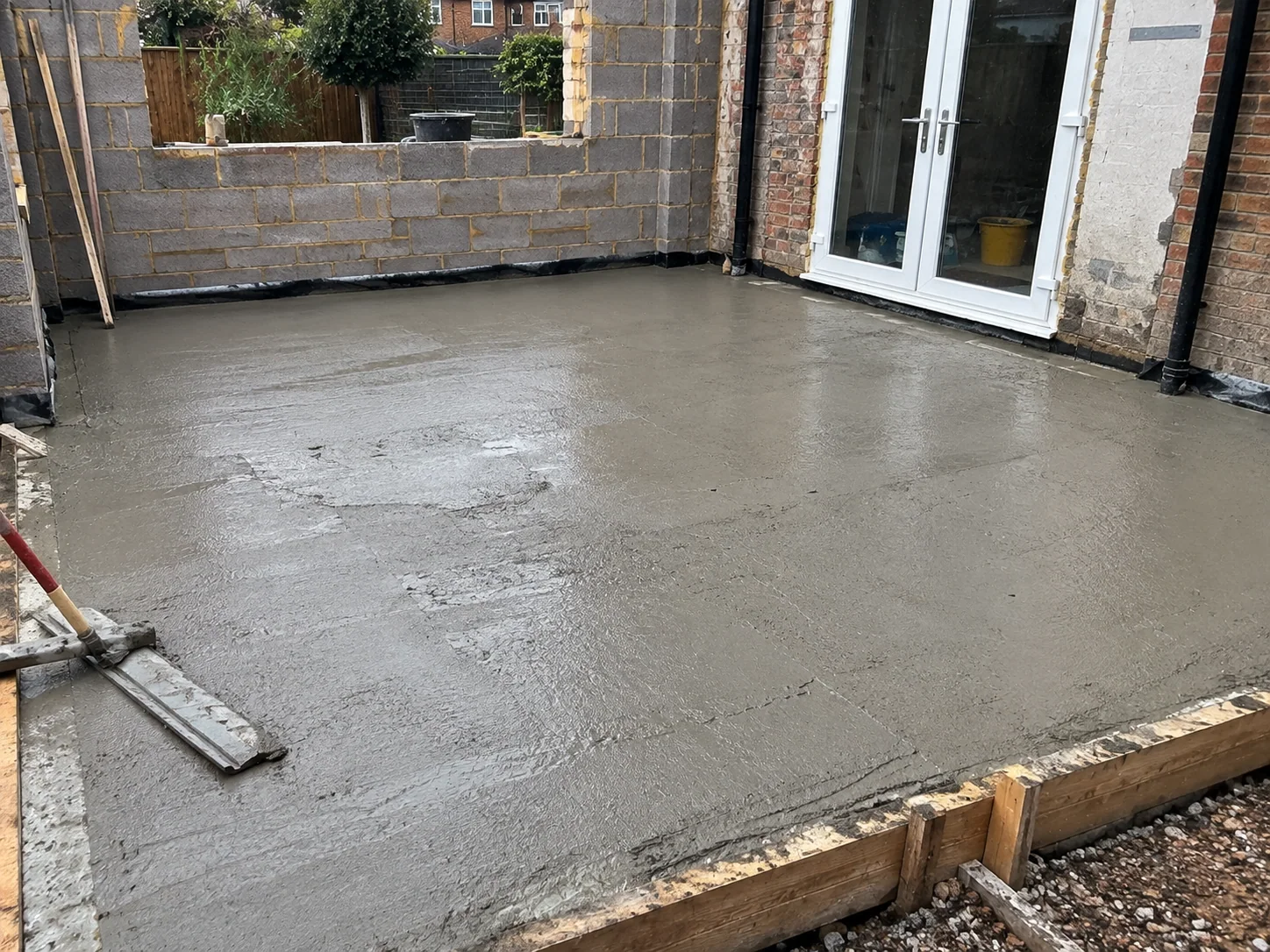 Residential concrete base prepared and levelled for a garden building in Barking